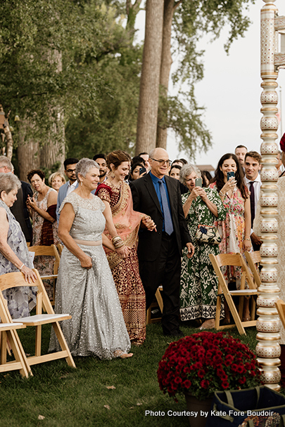 Indian bride entering into the marriage with her parents