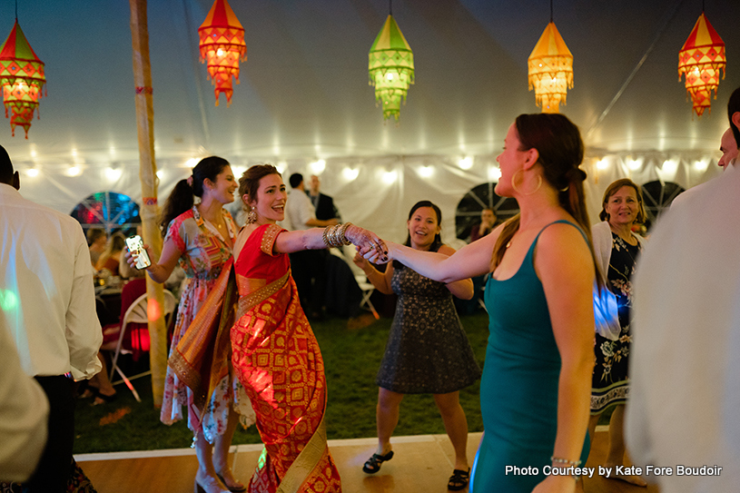 Indian bride dancing with her friend