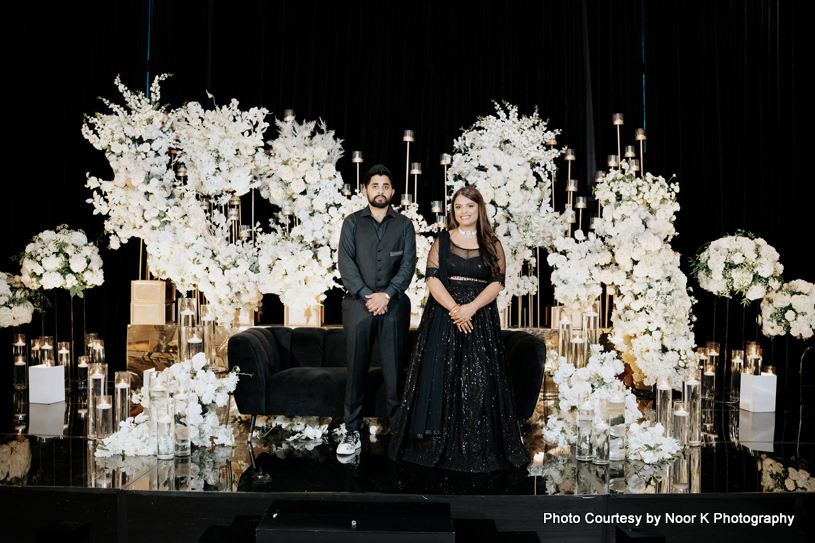 Indian wedding couple at beautifully decorated stage