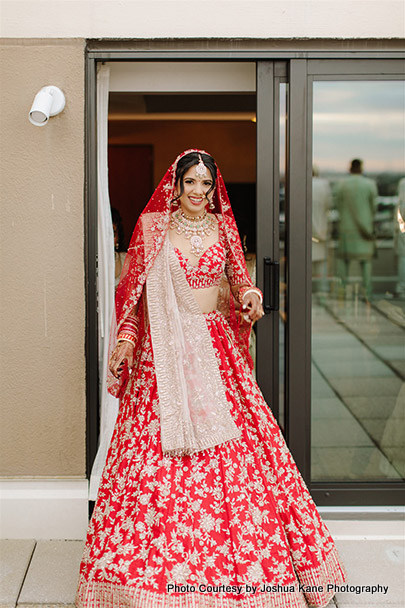 Indian bride looking gorgeous in red gown