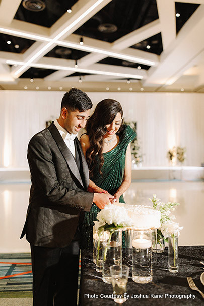 Indian wedding couple cake cutting ceremony