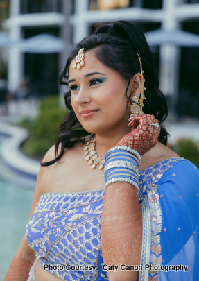 content/uploads/2025/09/WLP_0669.jpg" alt="A beautifully adorned bride in elegant attire and ornaments, preparing for her special day.