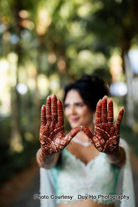 Indian bride shows her beautiful mehndi design