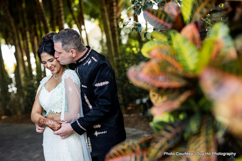 Couple’s intimate moments beautifully captured outdoors against a tropical backdrop Couple’s intimate moments beautifully captured outdoors against a tropical backdrop