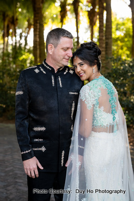 Couple’s intimate moments beautifully captured outdoors against a tropical backdrop