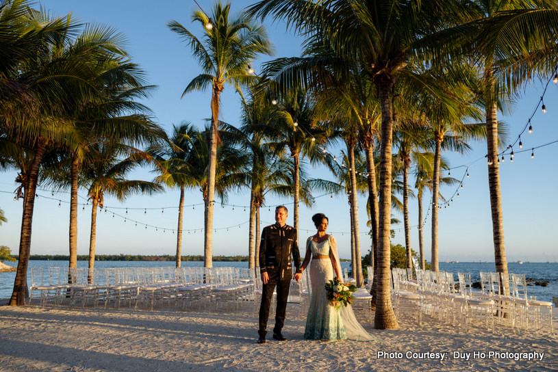 Ekta and Dan posing during their outdoor photoshoot at a beach resort in Florida Ekta and Dan posing during their outdoor photoshoot at a beach resort in Florida