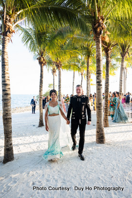 Colorful wedding attire and smiles as the couple celebrates their union.