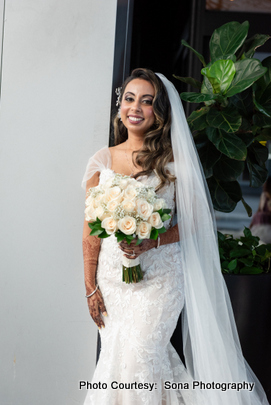 Ami posing for a photograph in her bridal outfit Ami posing for a photograph in her bridal outfit