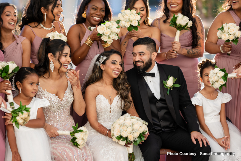 Indian wedding couple with bridemaids