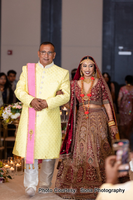 Bride enters to the wedding with her father