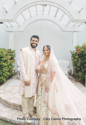 Newlyweds Ami and Vinny posing joyfully