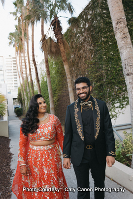 A beautiful outdoor portrait of a newlywed couple celebrating their wedding day with scenic natural surroundings