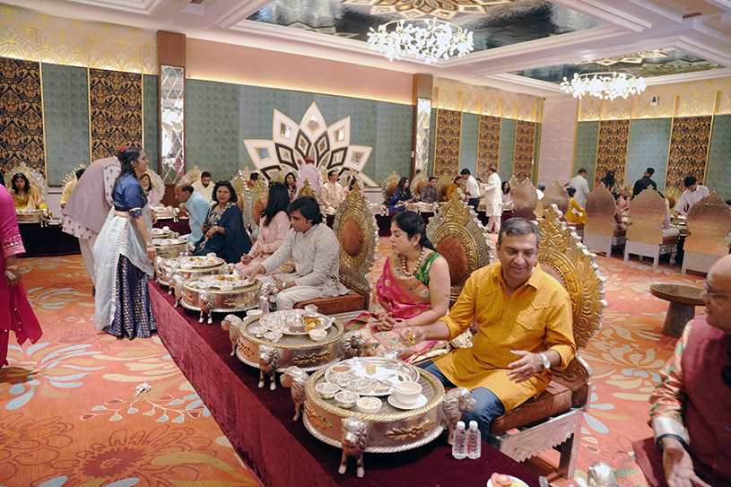 Family and friends dining together during Radhika Agarwal and Krishan Garg’s silver anniversary celebrations
