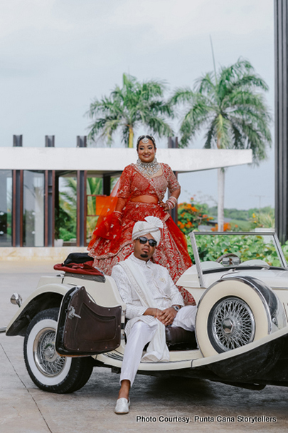 Indian bride and groom looking like maharaja and maharani