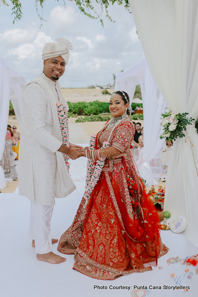 Indian bride and groom perfoming garland ceremony