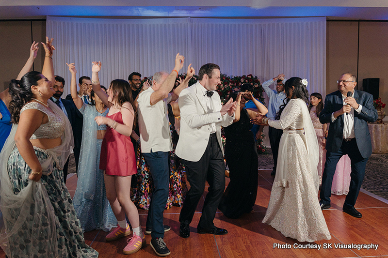 Guests dancing together on the dance floor at Sujata and Mark wedding reception