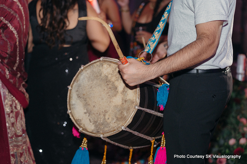 Dhol drummer performing at Sujata and Mark Indian wedding celebration